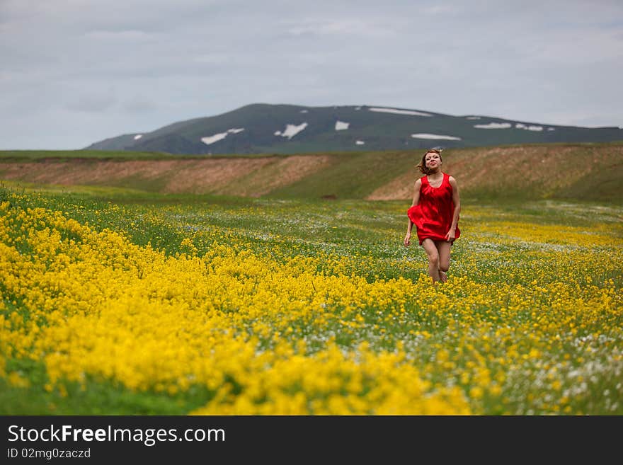 The girl in a blossoming field