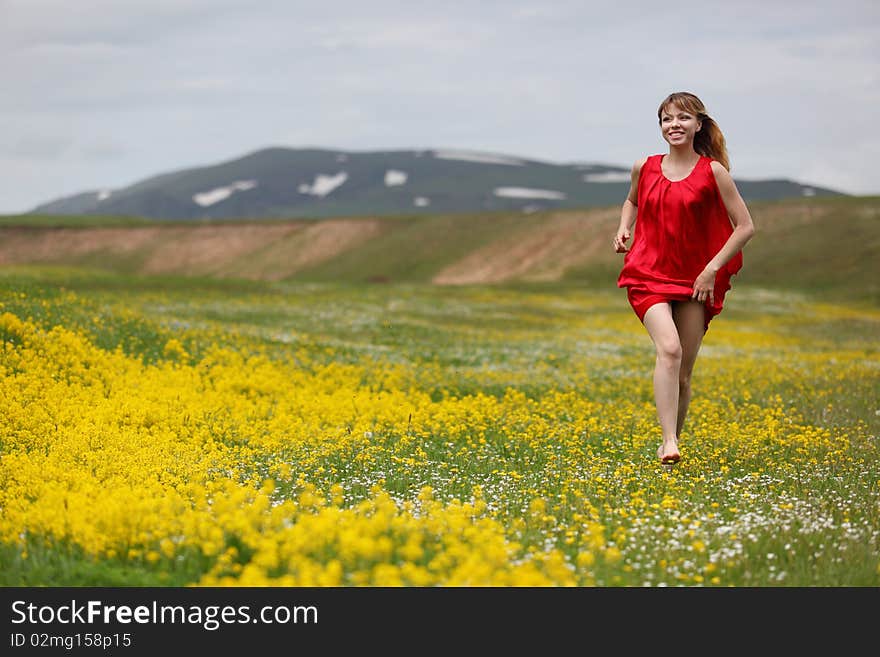 The girl in a blossoming field