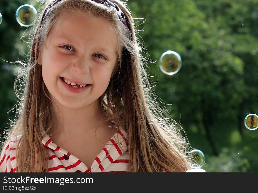 An image of a nice little girl laughing. An image of a nice little girl laughing