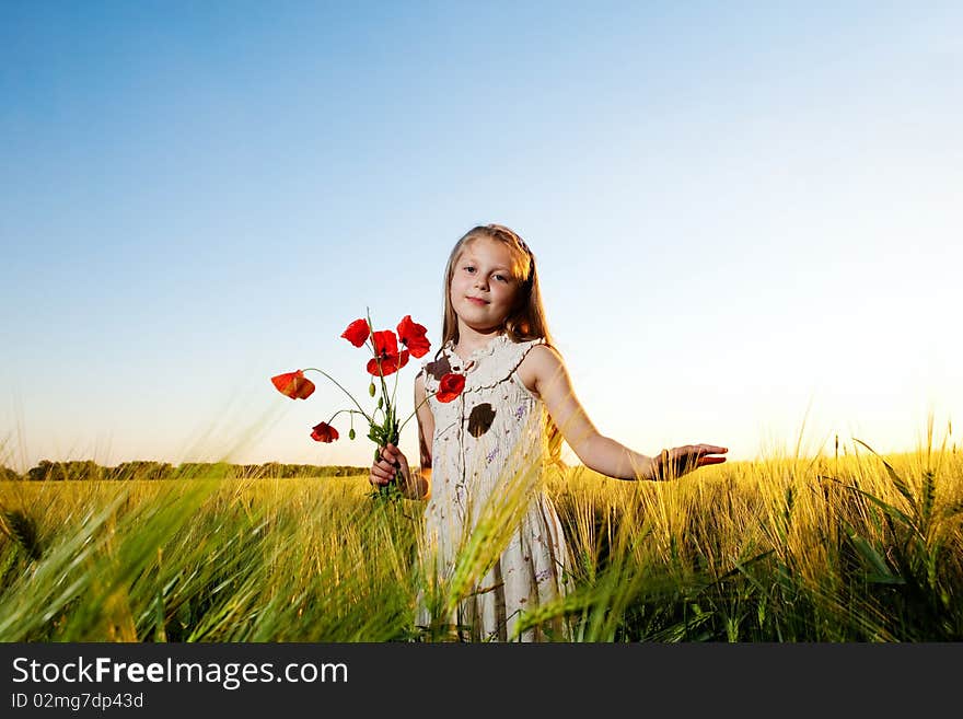 An image of a beautiful girl in the field. An image of a beautiful girl in the field