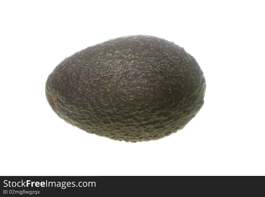 Whole avocado black skin variety over white isolated