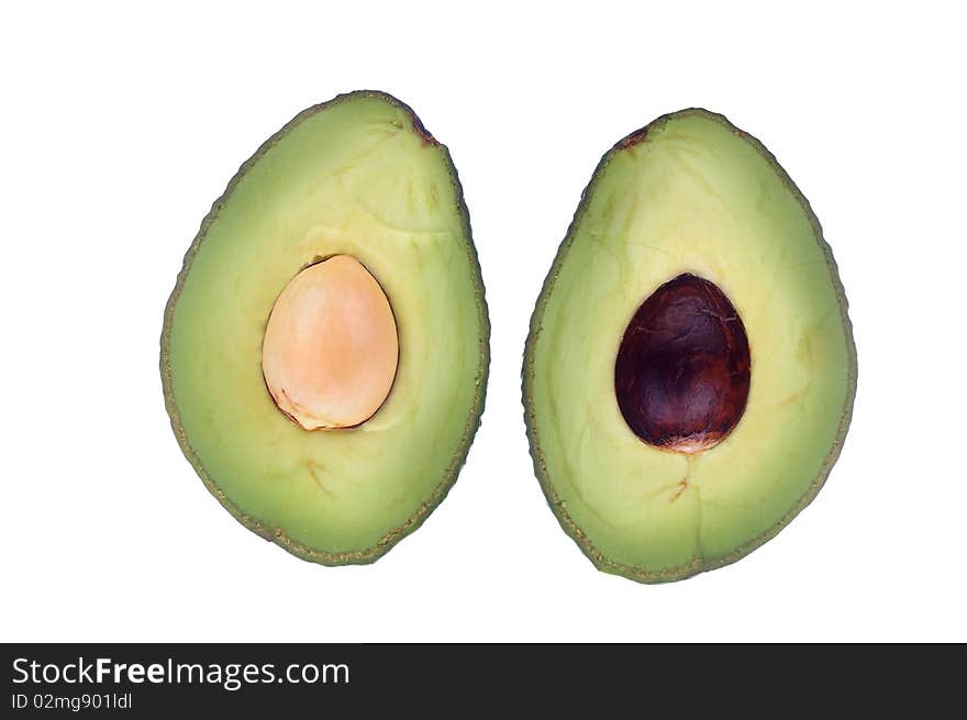 Avocado halved with seed over white isolated. Avocado halved with seed over white isolated