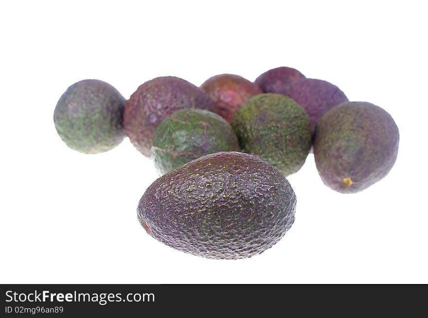 Whole avocado black skin variety over white isolated