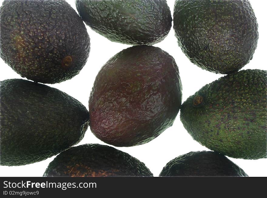 Whole avocado black skin variety over white isolated