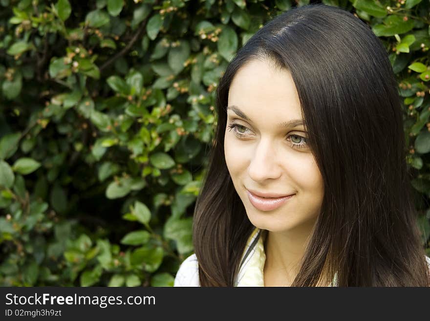 Laughing beautiful young woman outdoors in nature. Laughing beautiful young woman outdoors in nature