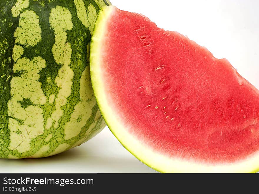 Piece cut out of watermelon on the white background. Piece cut out of watermelon on the white background