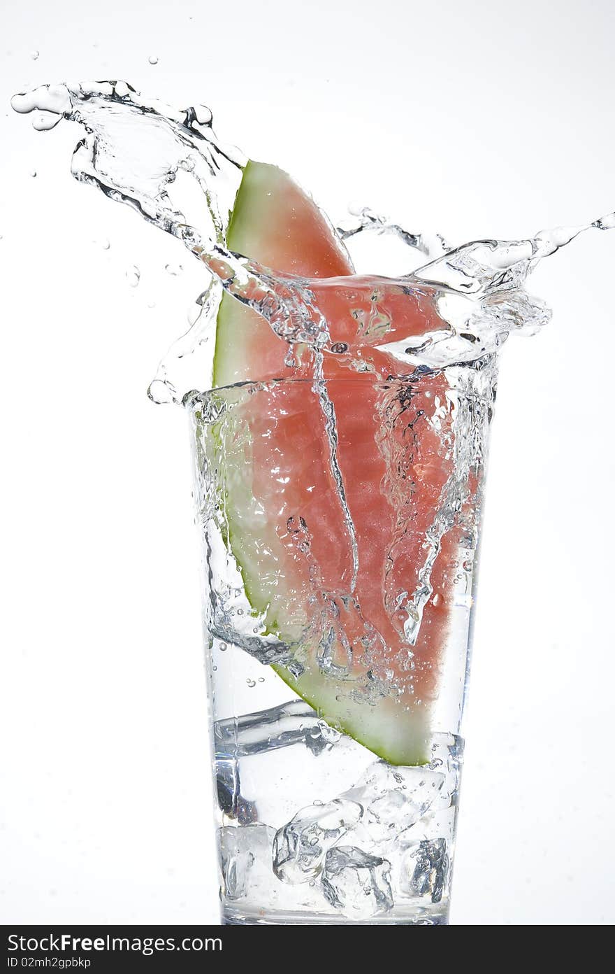 Water-melon falling on the clear water