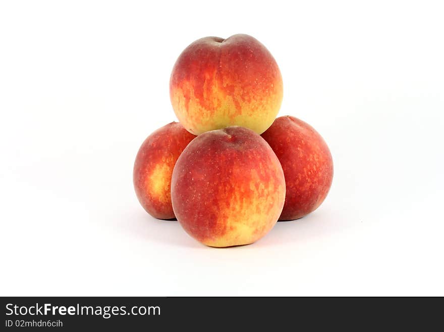 Fresh colorful ripe peaches isolated on white