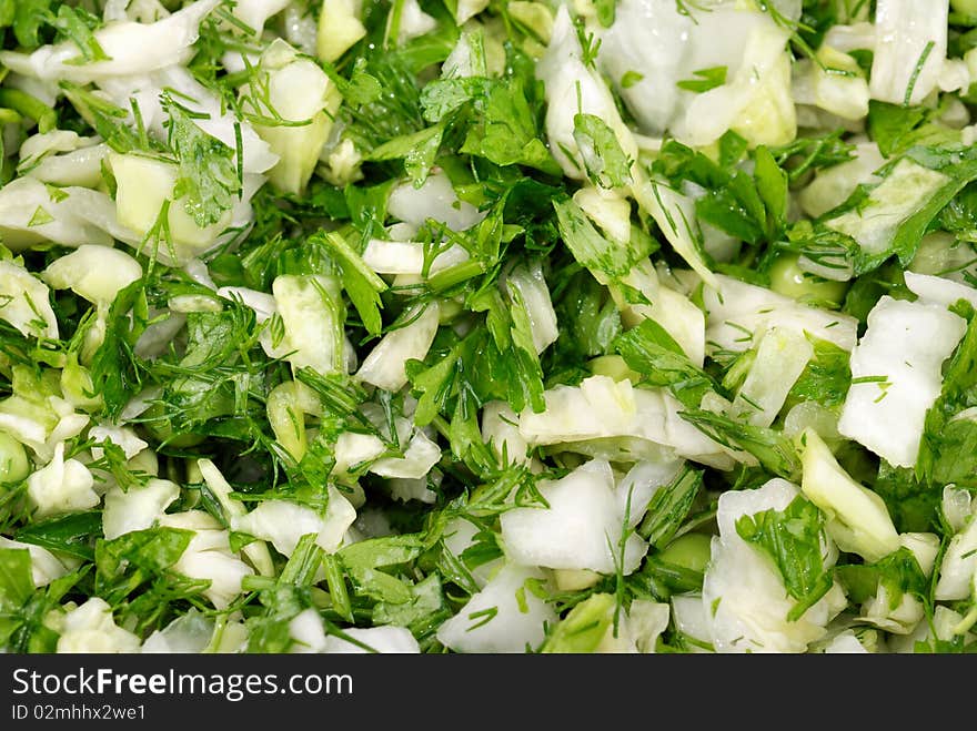 Fresh salad from vegetables and greens on a plate. Fresh salad from vegetables and greens on a plate