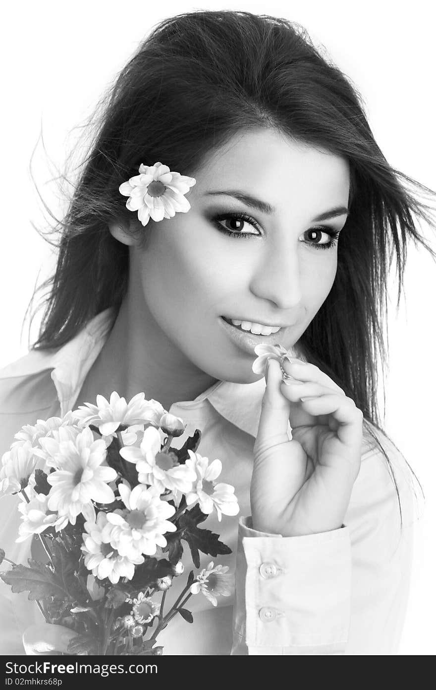 Young beautiful woman with pink flower.