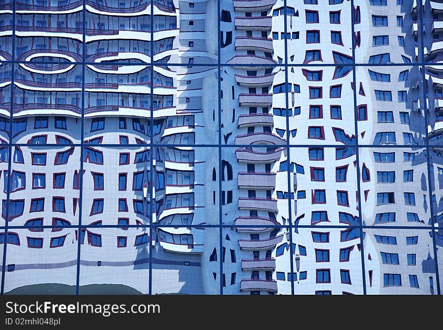 The building is reflected in mirror glasses. The building is reflected in mirror glasses.