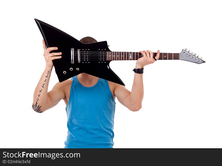 Guitar player holding his guitar over face, on white