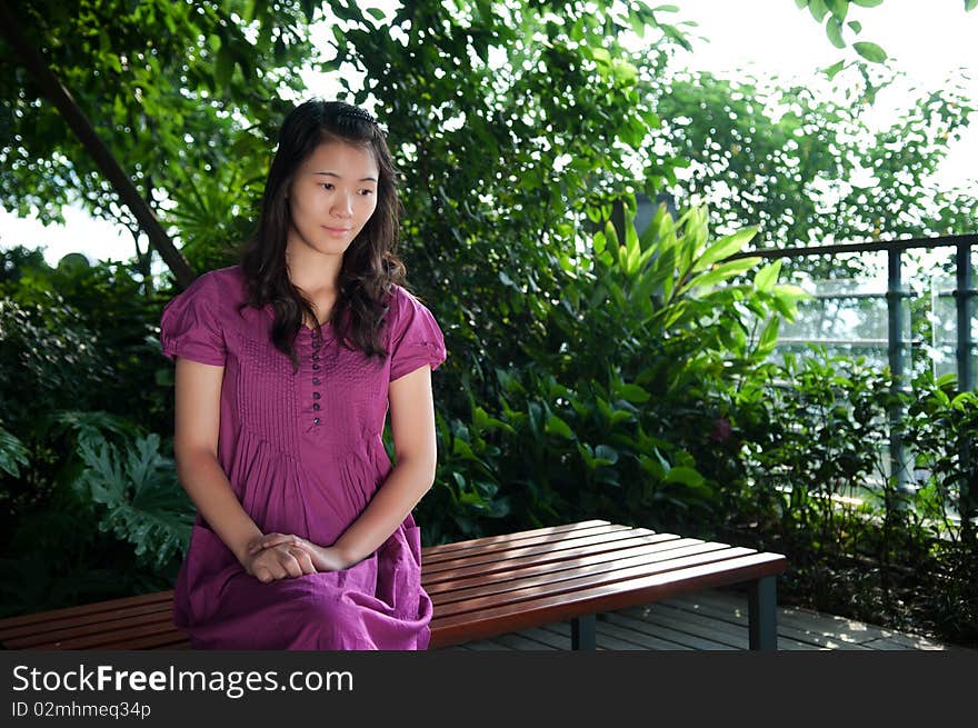 The beautiful woman sat on the bench. The beautiful woman sat on the bench