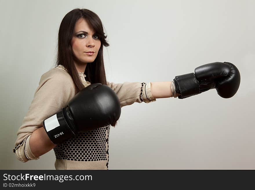 Beautiful woman wearing boxing gloves. Beautiful woman wearing boxing gloves