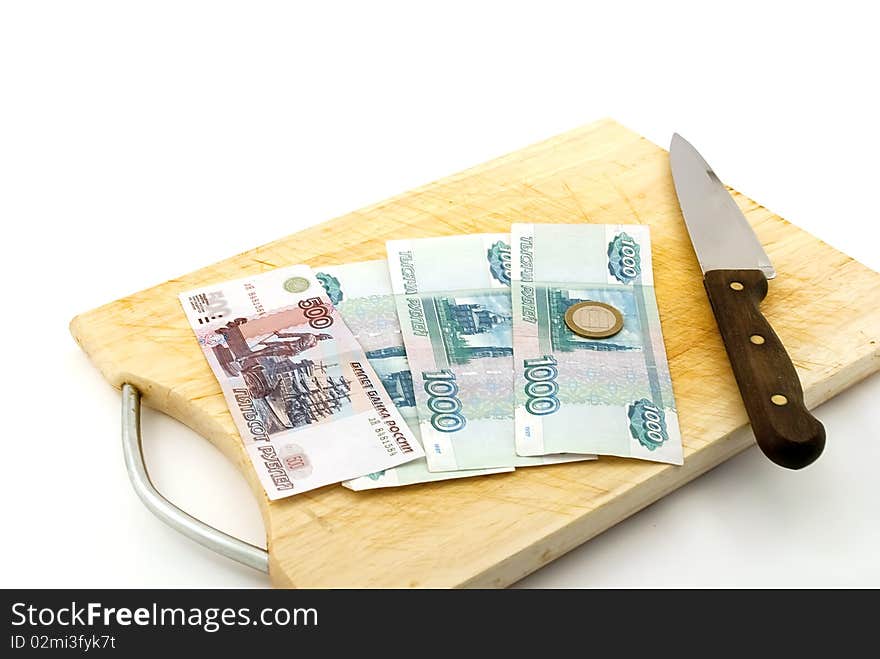 Money, knife for a board for are sharp on a white background.