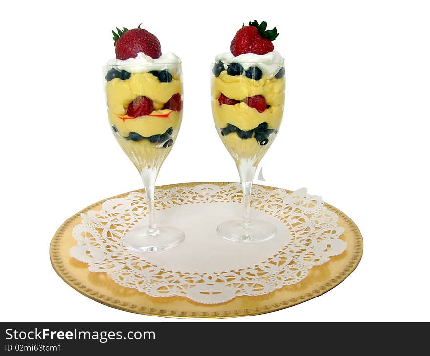 Two parfait in crystal stemware, vanilla with assorted berries. Two parfait in crystal stemware, vanilla with assorted berries.