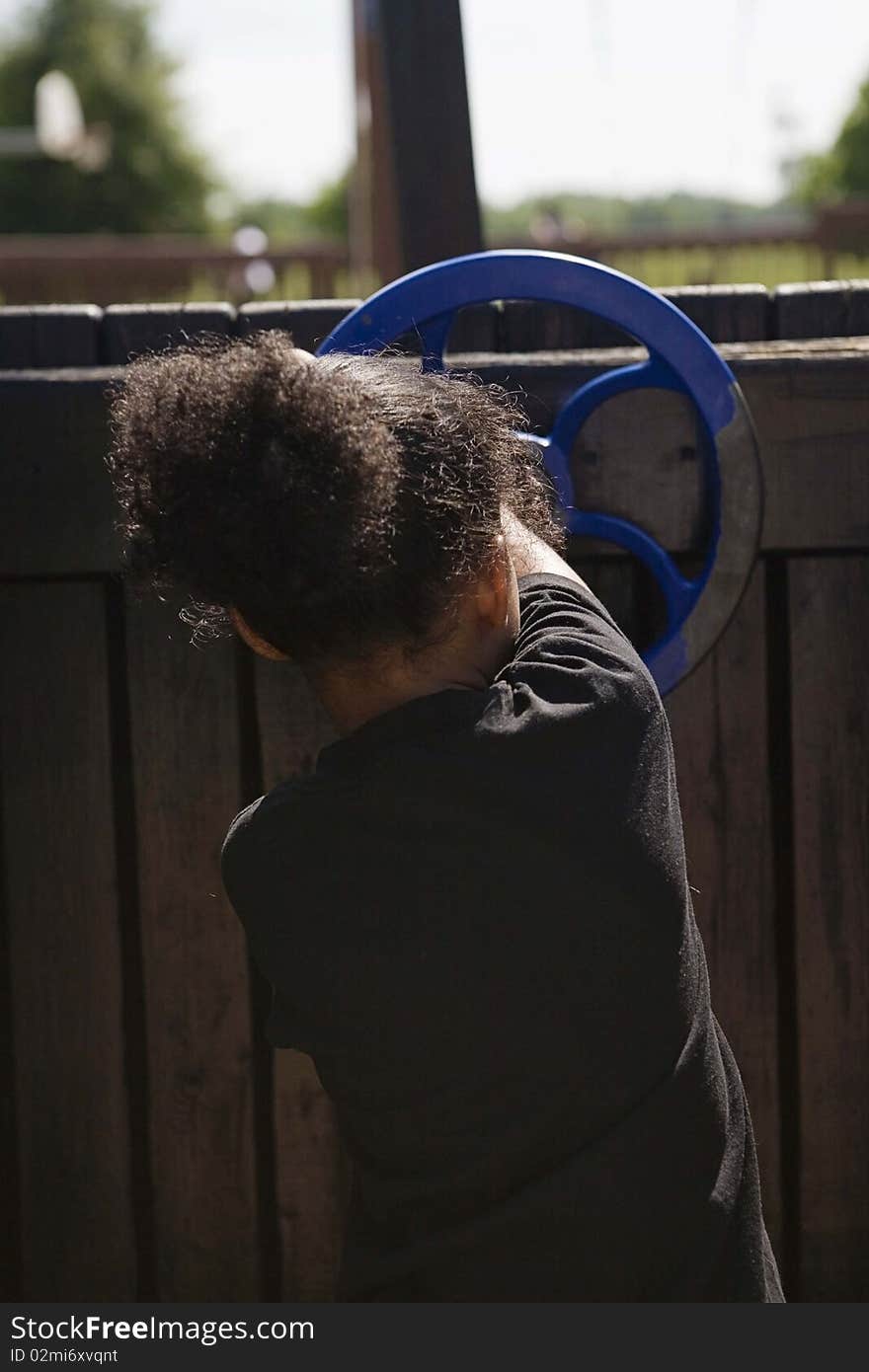 Little girl playing at playground