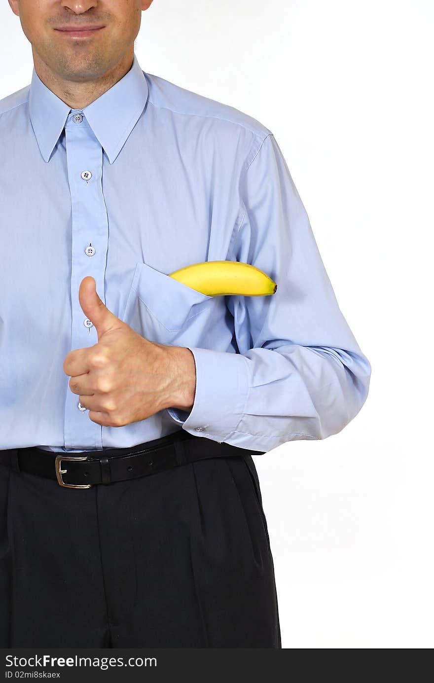 Man in the suit with the banana into pockets on the white background. Man in the suit with the banana into pockets on the white background