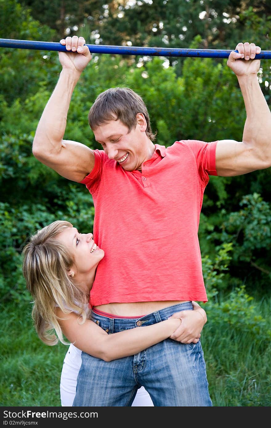 Portrait of a beautiful young couples are happily embracing at walk. Portrait of a beautiful young couples are happily embracing at walk