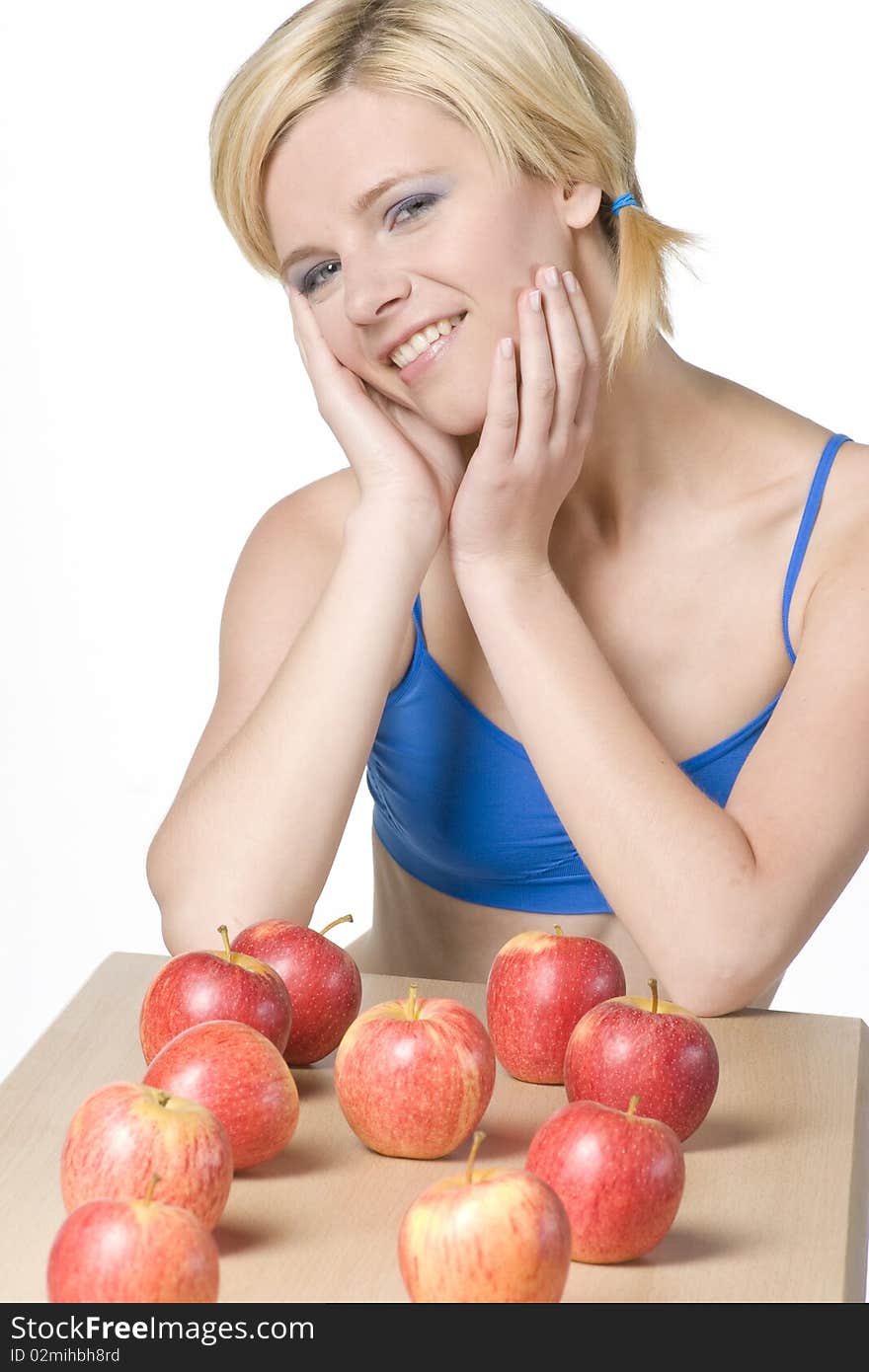 Portrait of young woman with apples