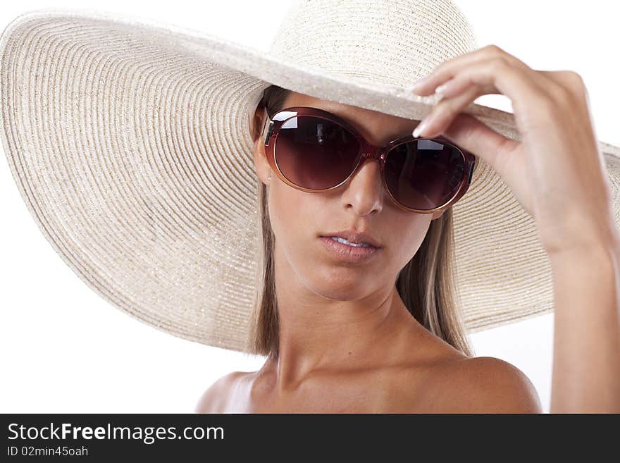 Beautiful blond women wearing a hat and sunglasses in hot summer day. Beautiful blond women wearing a hat and sunglasses in hot summer day