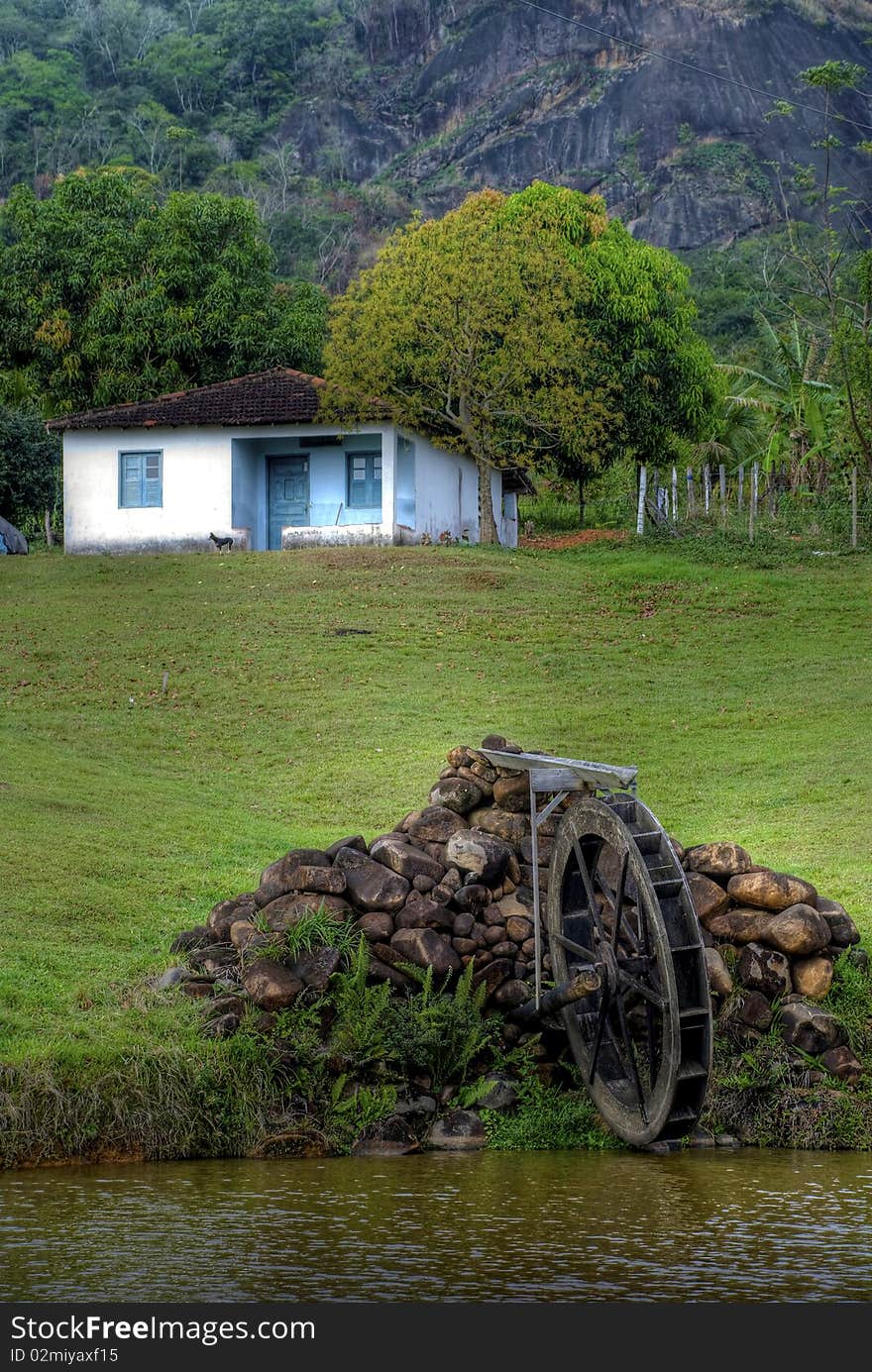 This image is of a house with water mill in rural zone.Was taken in Rio de Janeiro. Photo taken on: September 10th, 2008