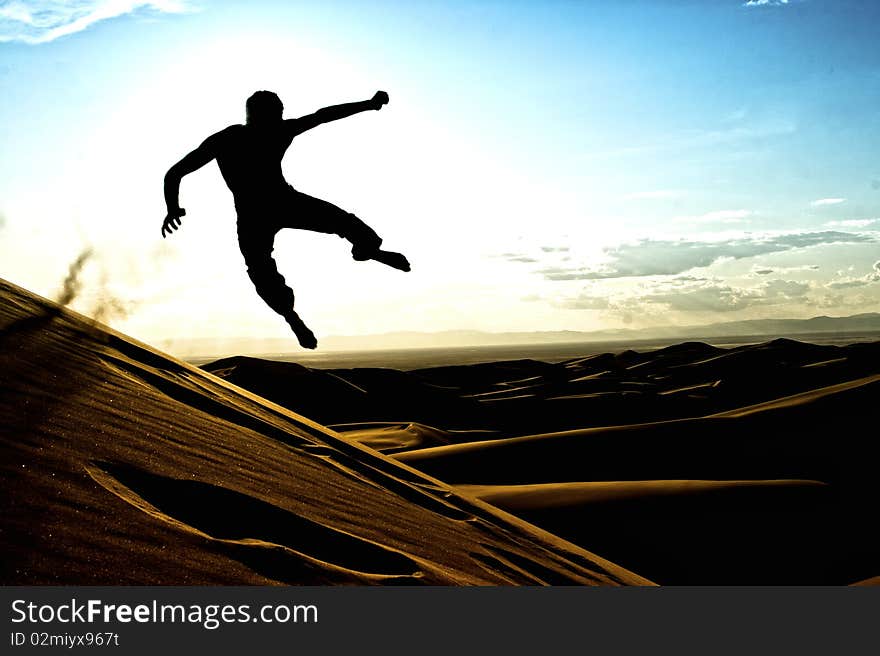 Acrobatic silhouette in the Great Sand Dunes National Park in Colorado. Acrobatic silhouette in the Great Sand Dunes National Park in Colorado