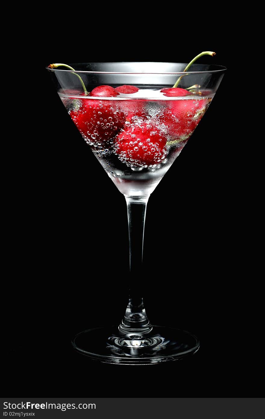 Cherry sparkling in the cocktail glass with soda water. Cherry sparkling in the cocktail glass with soda water