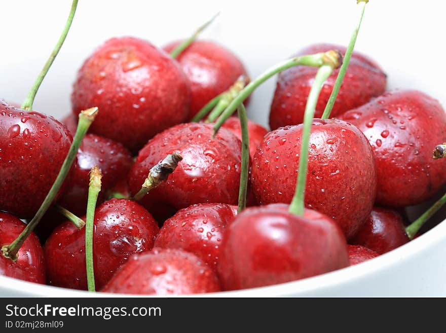 Cherry in the bowl with black background. Cherry in the bowl with black background.