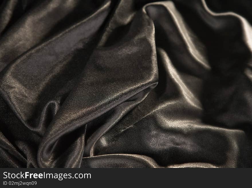 Close-up picture of elegant and soft black fabric fold. Close-up picture of elegant and soft black fabric fold