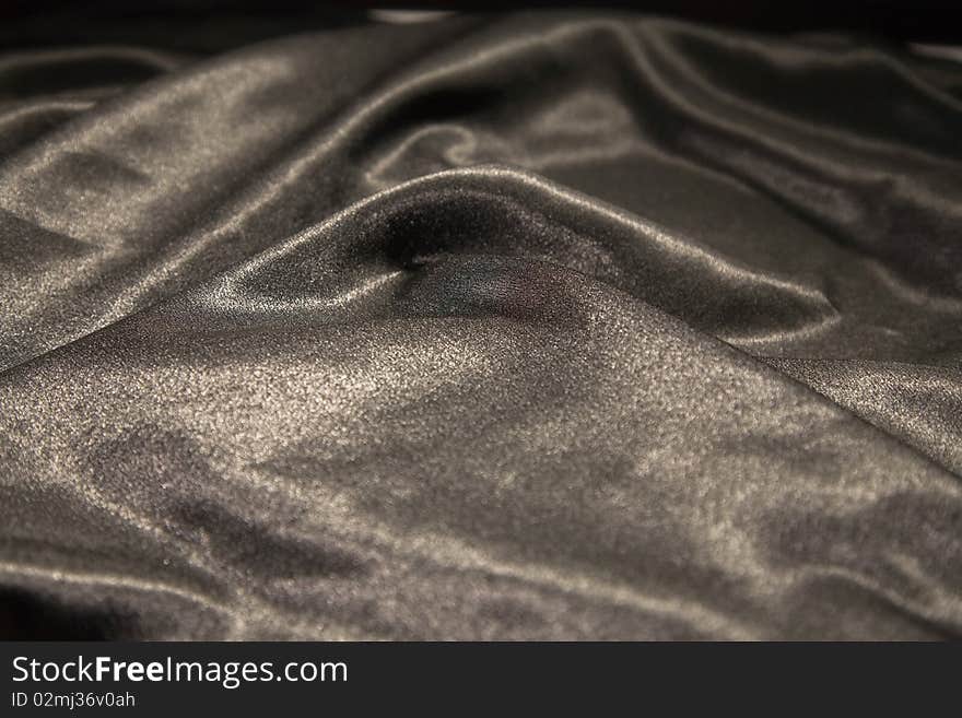 Close-up picture of elegant and soft black fabric fold. Close-up picture of elegant and soft black fabric fold