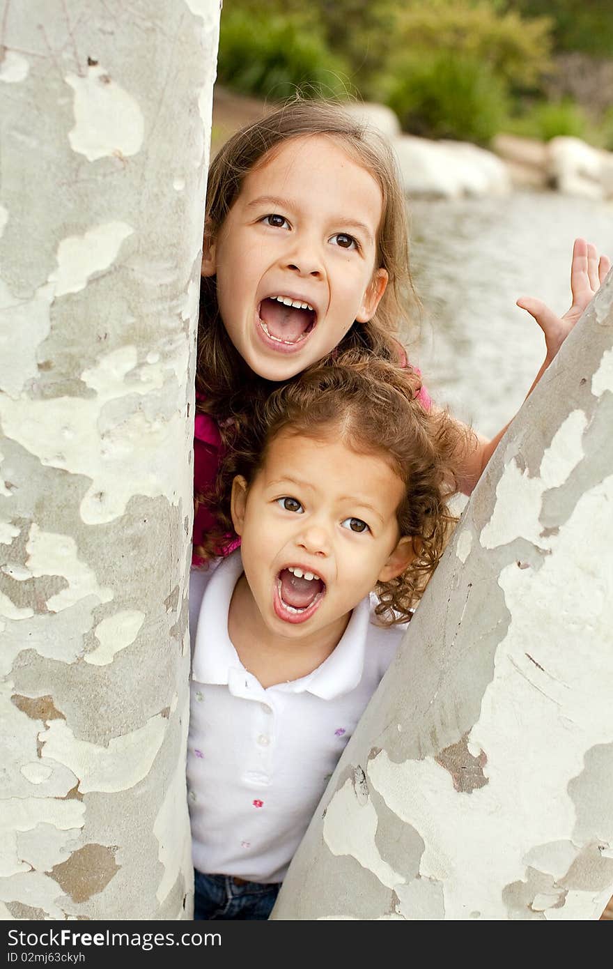 Cute little sisters playing outside