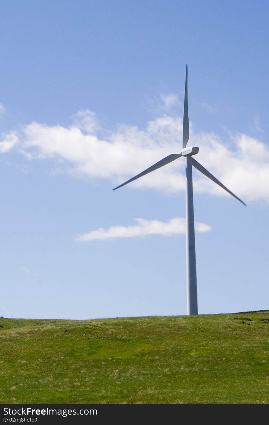 A windmill against a blue sky just south of Boulder, Colorado.