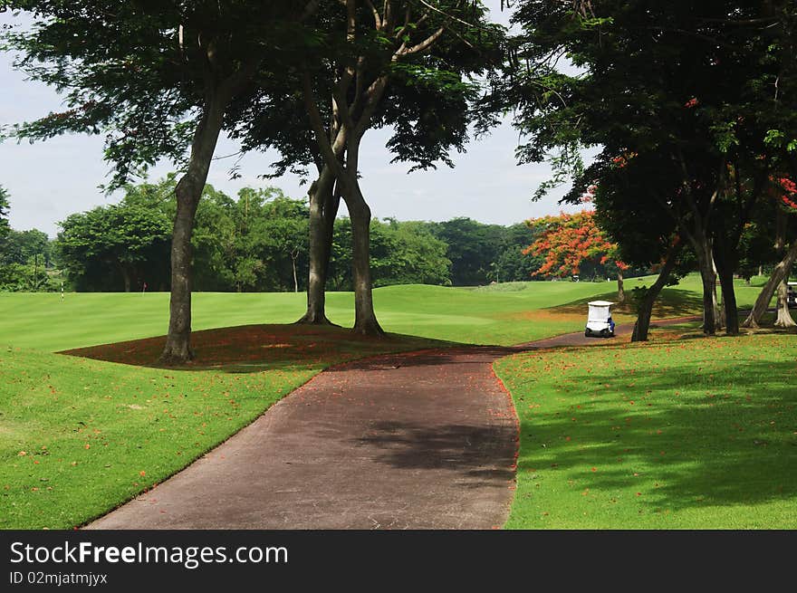 Golf carts in a beautiful golf course in the Philippines. Golf carts in a beautiful golf course in the Philippines