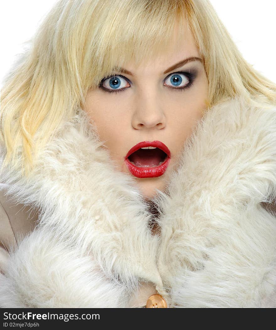 Gasping blond in a winter coat with bright blue eyes. Gasping blond in a winter coat with bright blue eyes