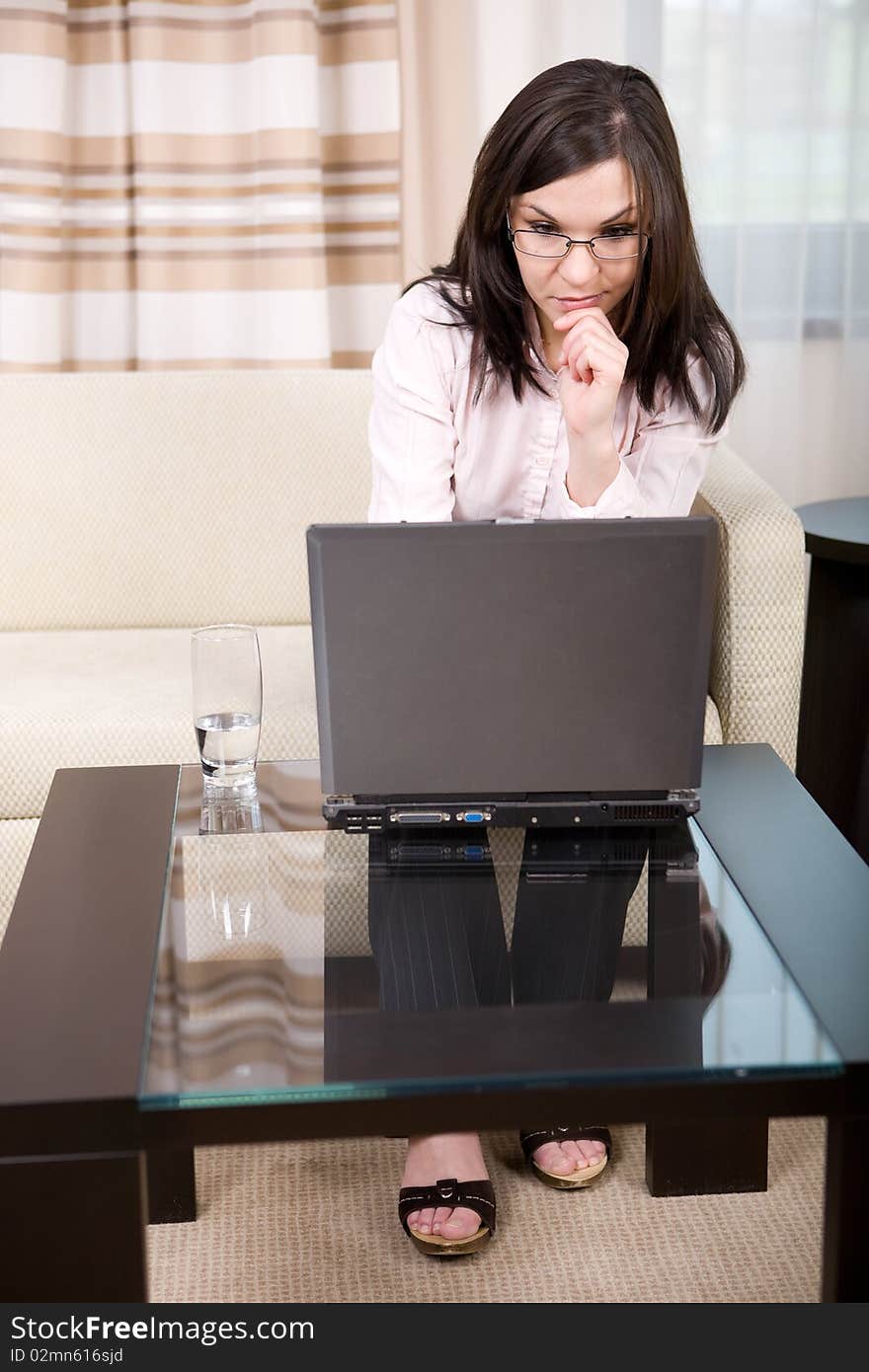 Young attractive brunette woman in office. Young attractive brunette woman in office