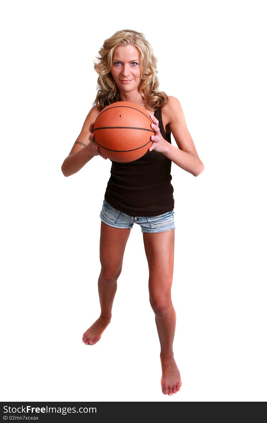 Attractive female basketball player with a white background. Attractive female basketball player with a white background