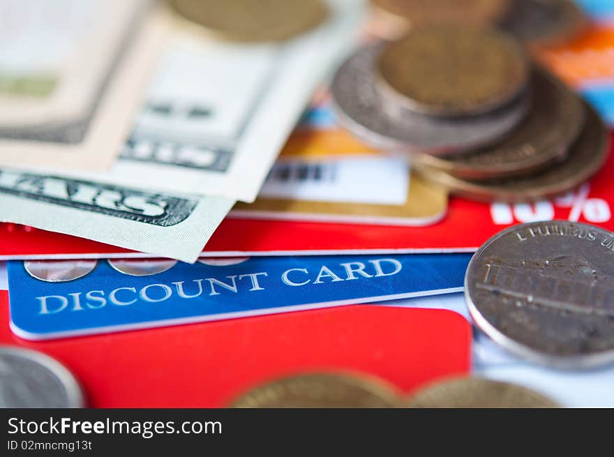 Bright plastic discount cards and usd money closeup. selective focus. Bright plastic discount cards and usd money closeup. selective focus.