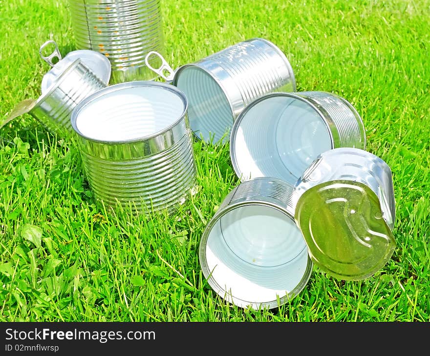 Tins in grass - recycling concept. Tins in grass - recycling concept