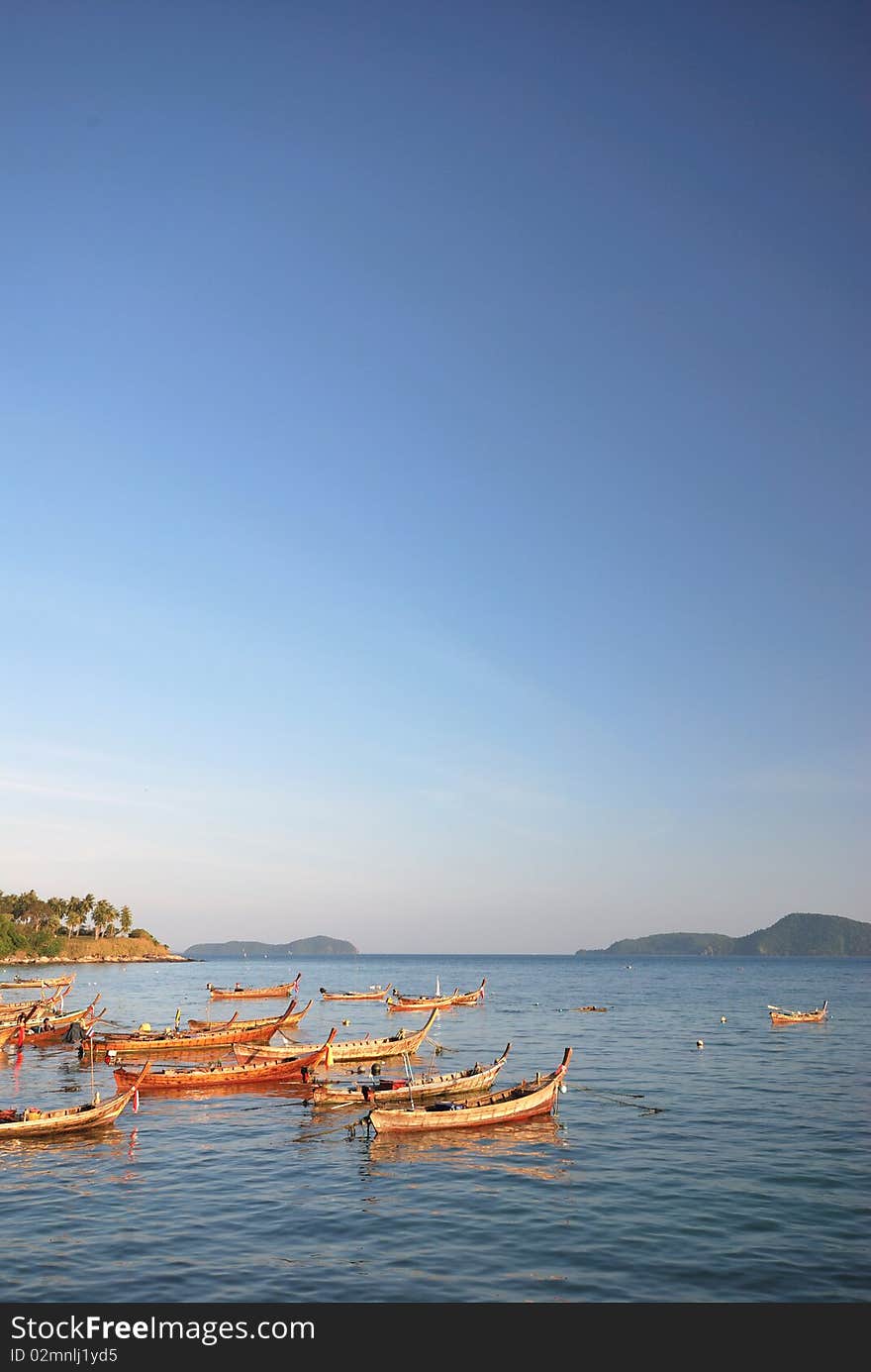 Thai Boat parking on the beach in the day. Thai Boat parking on the beach in the day