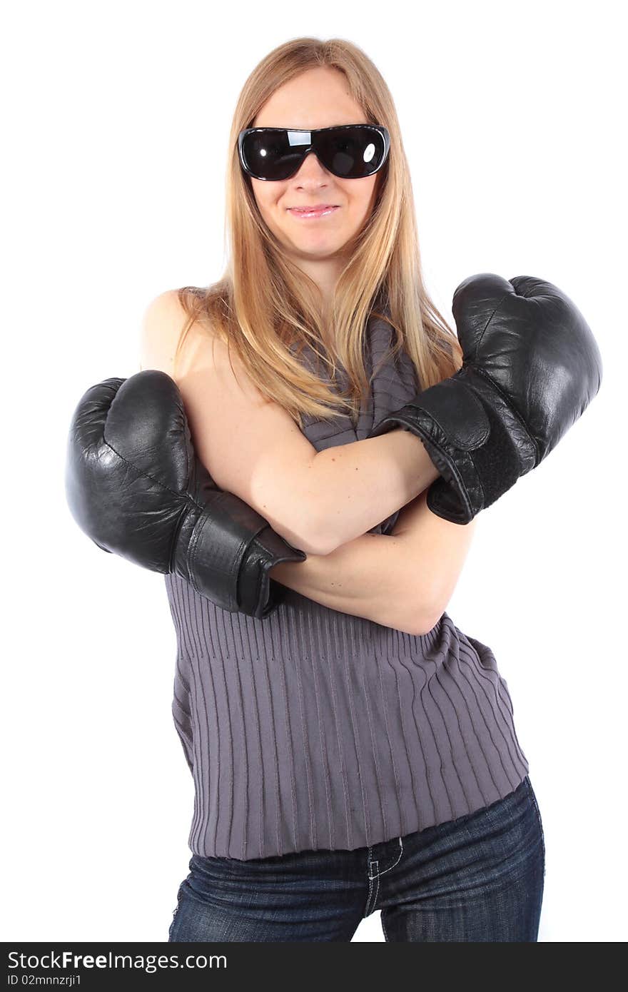 Pretty young lady smiling with boxing gloves. Isolated on white background. Pretty young lady smiling with boxing gloves. Isolated on white background