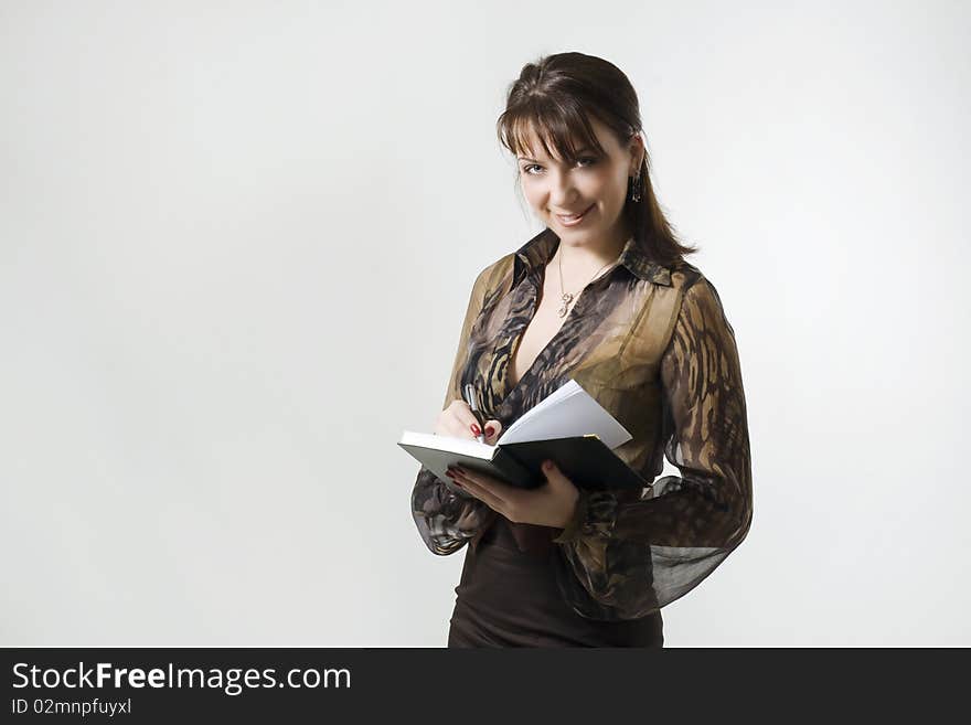 Businesswoman Writing In Notebook