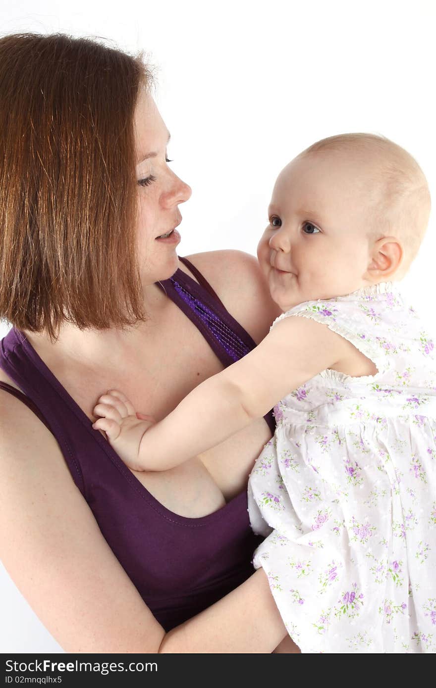 Mother keeps on hand a little baby