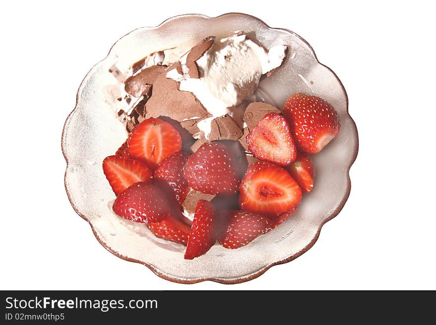 Pieces of strawberry with ice cream in a glass vase