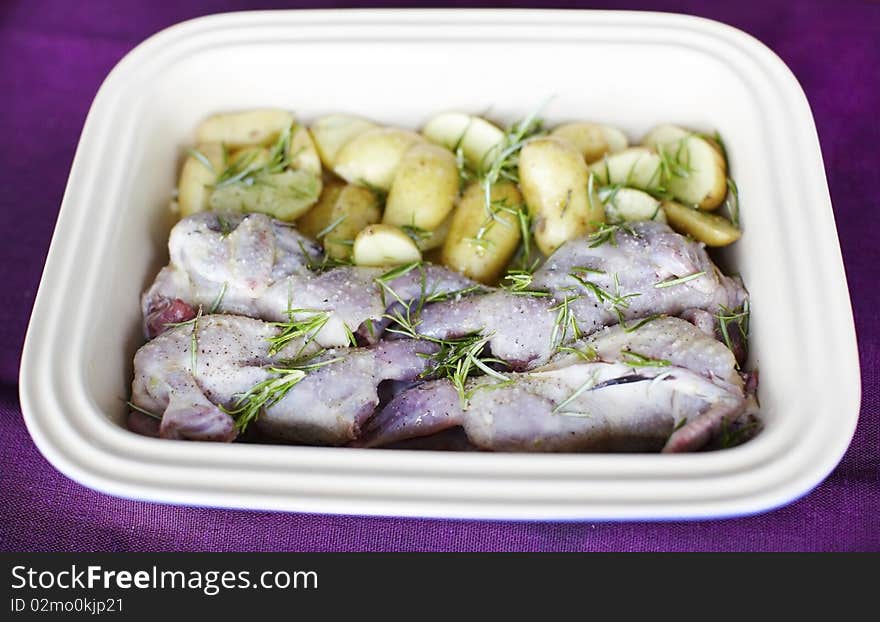 Raw Quail With Potatoes And Rosemary