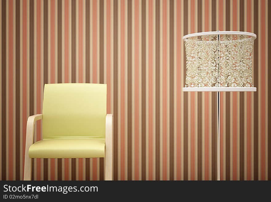 Yellow chair, lamp and striped wallpaper