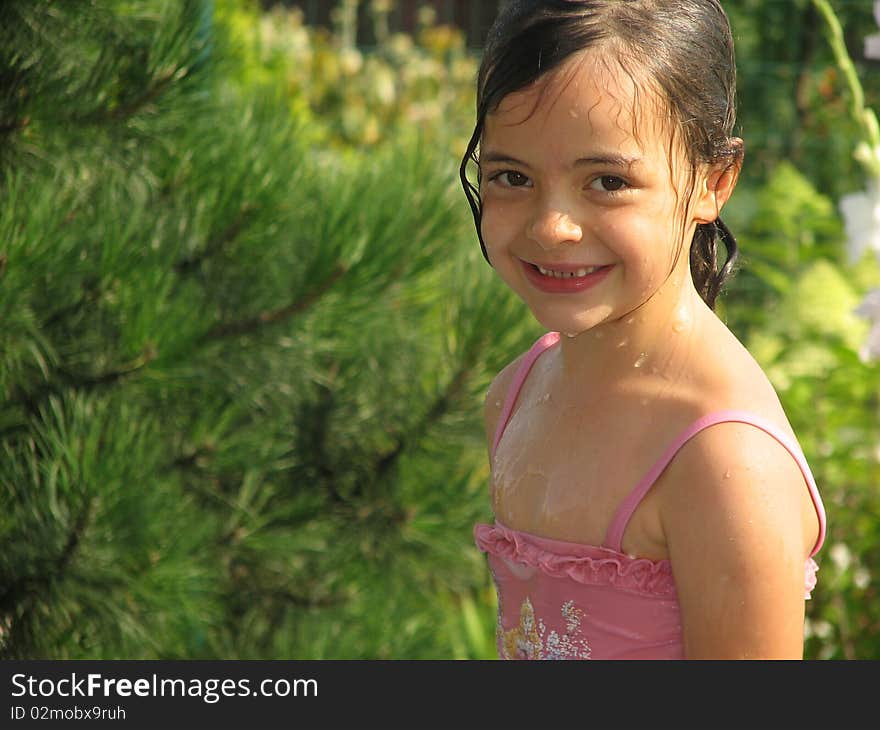 Lovely  and wet girl in the garden