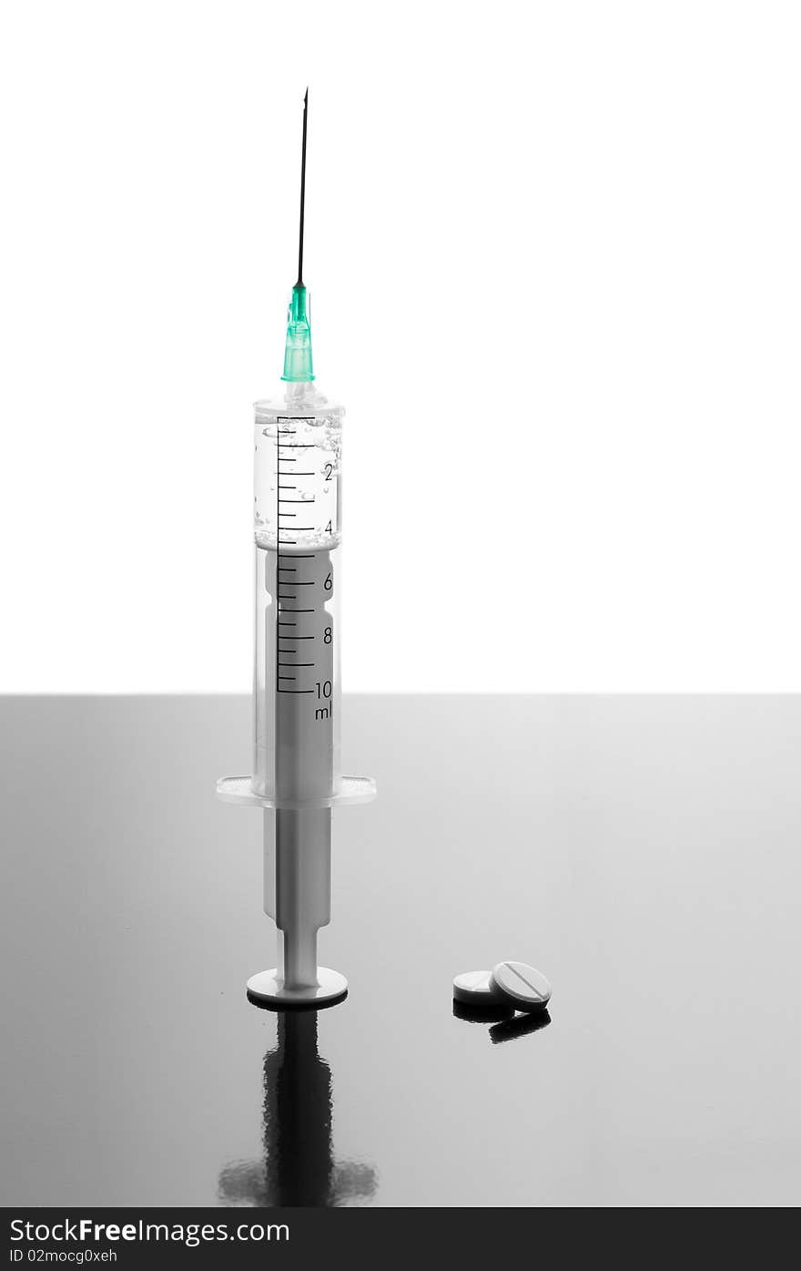 Syringe and tablets