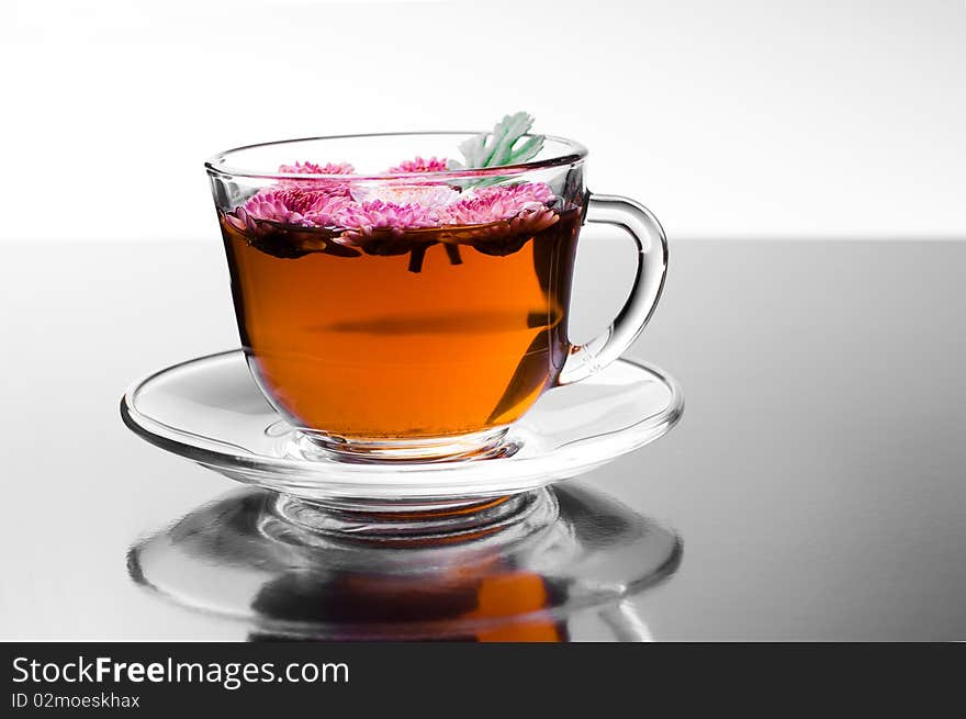 Cup of herbal tea with flowers