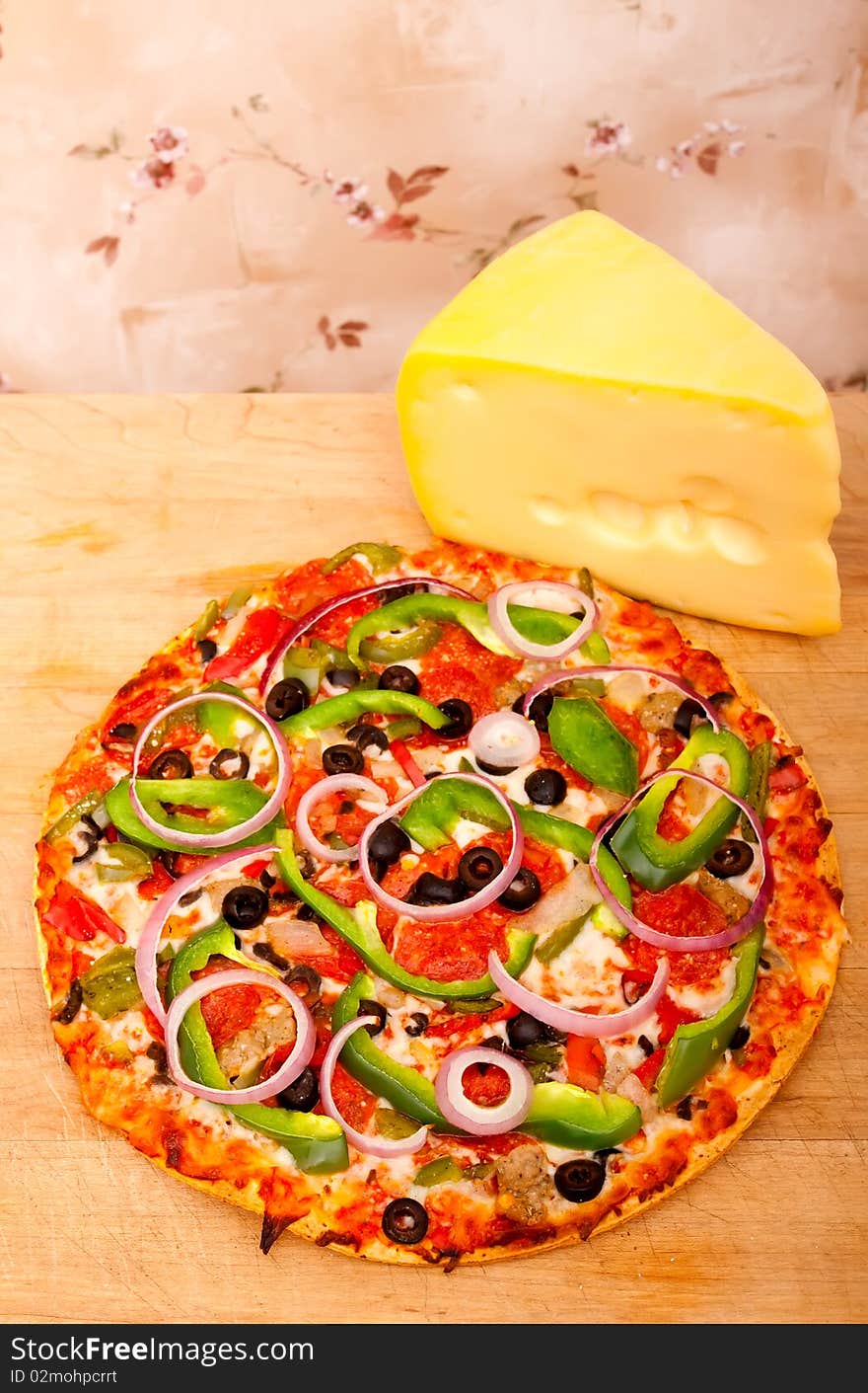 Pizza with vegetables and pepperoni